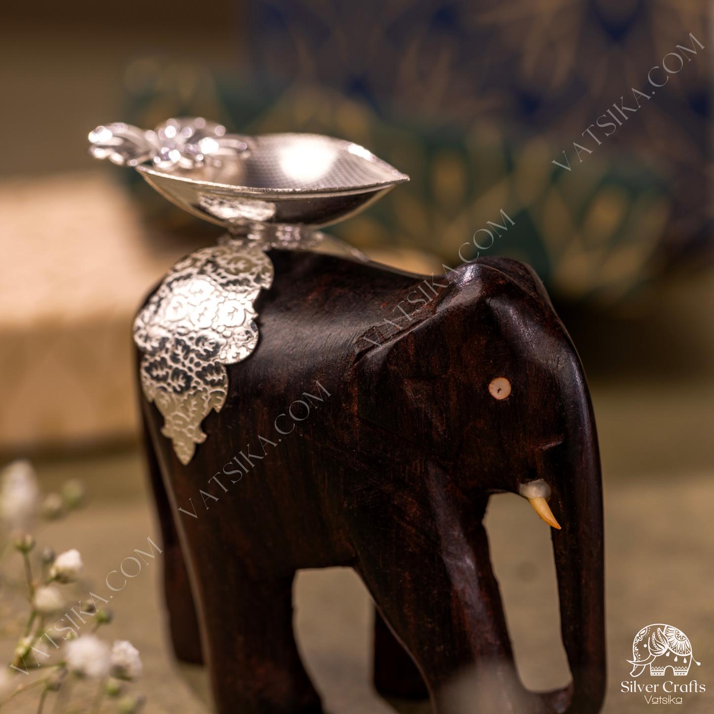 Silver Deepas on a Rosewood elephant for Lakshmi Devi