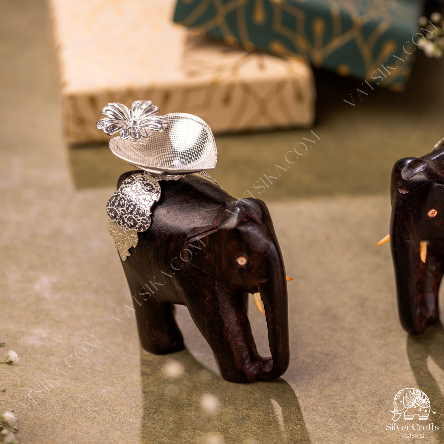 Silver Deepas on a Rosewood elephant for Lakshmi Devi